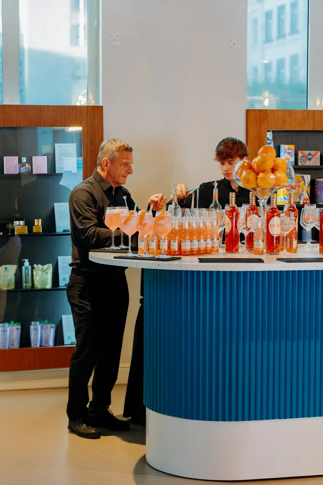Bartenders serving at the island bar