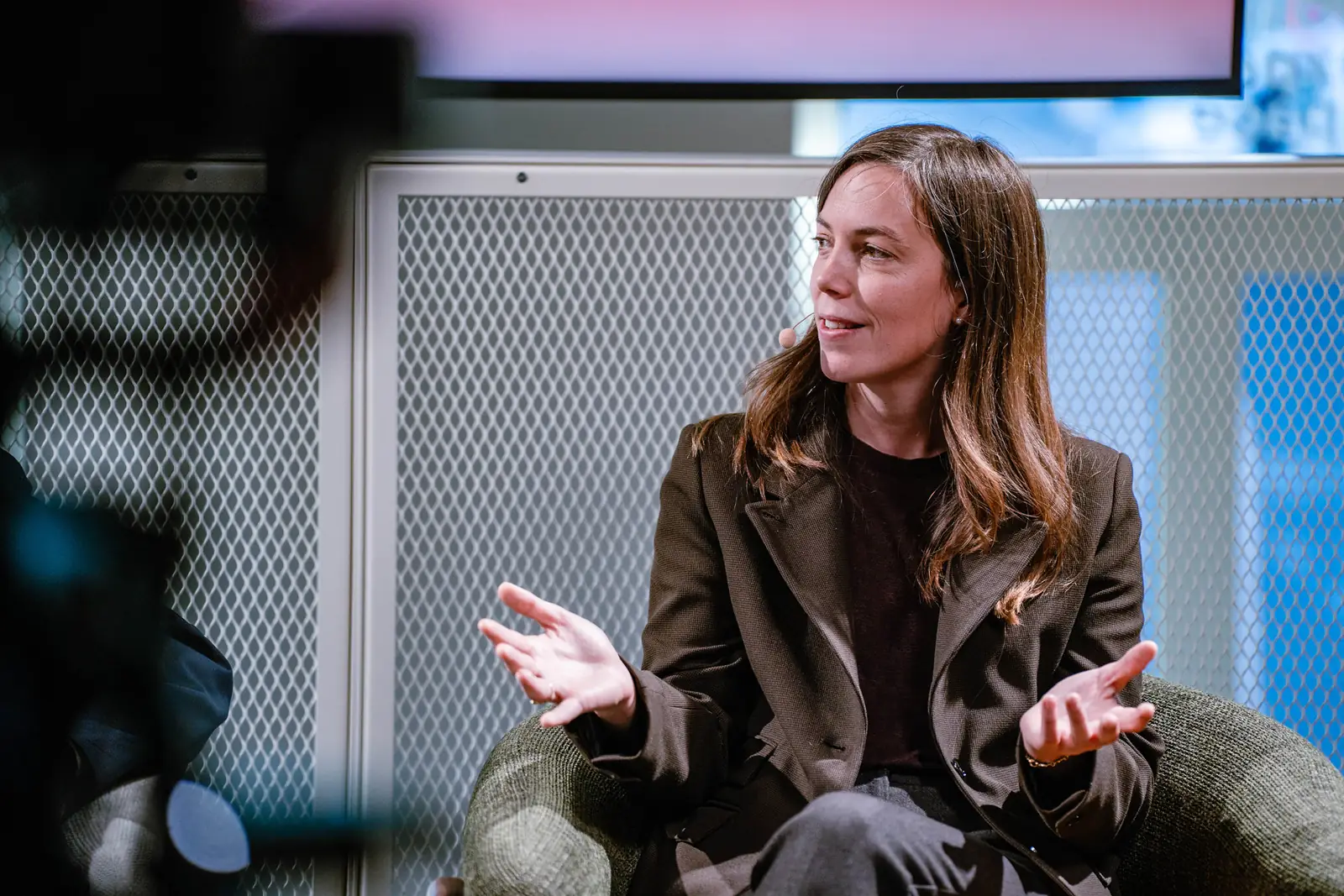 A panellist speaking in the lounge set