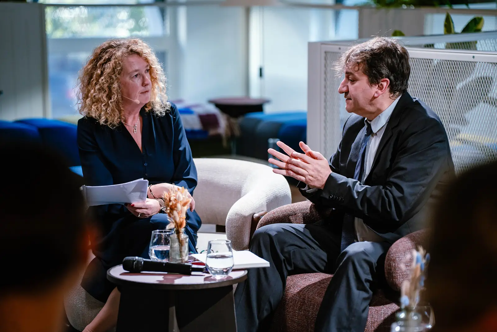 Two speakers in a fireside conversation