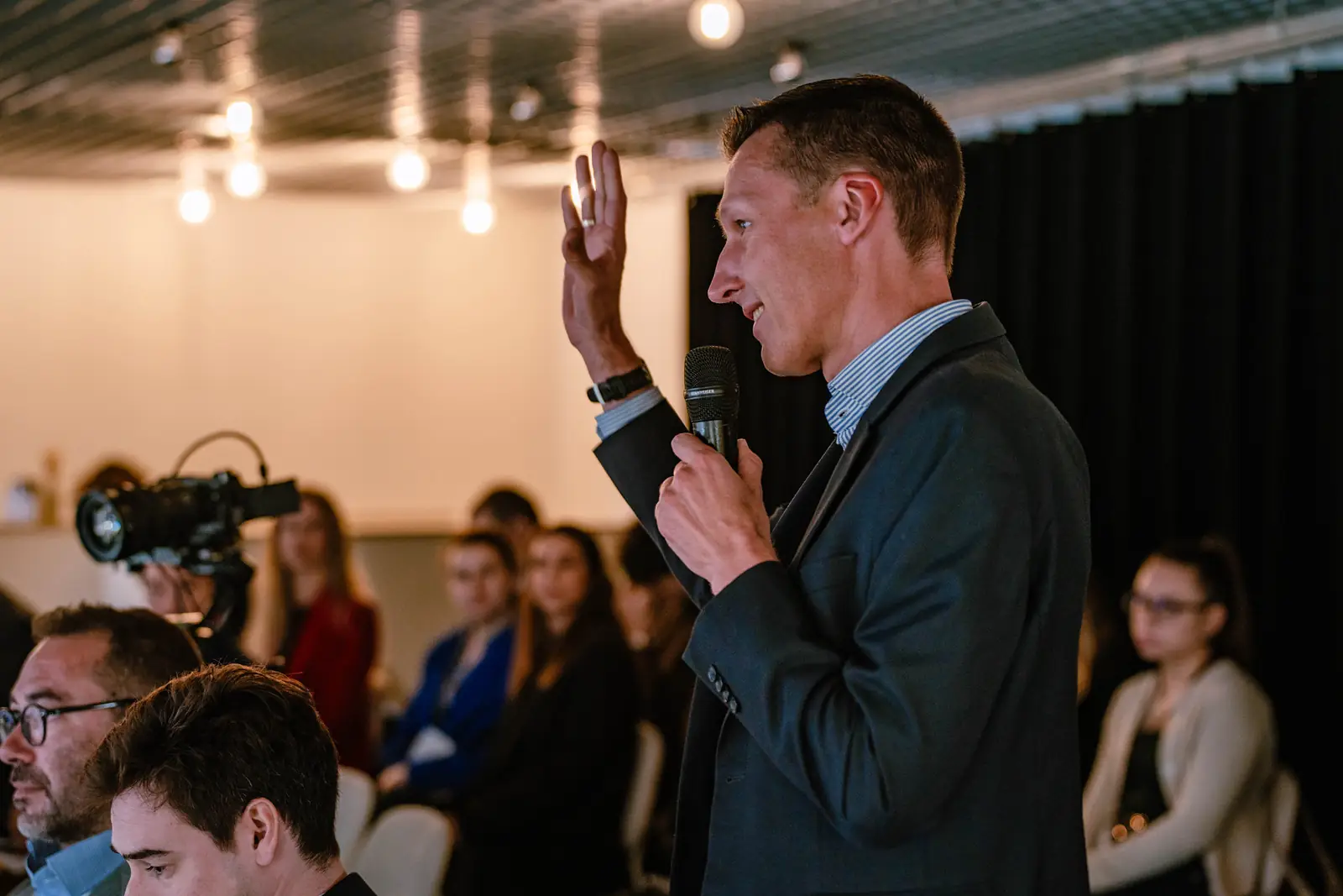 A guest asking a question from the audience