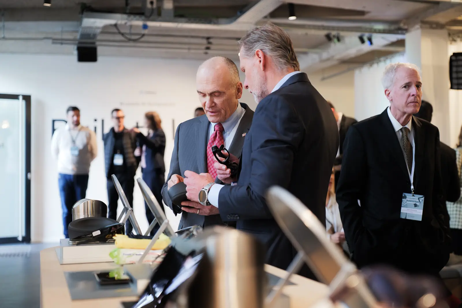 Guests trying AI glasses at a demo table