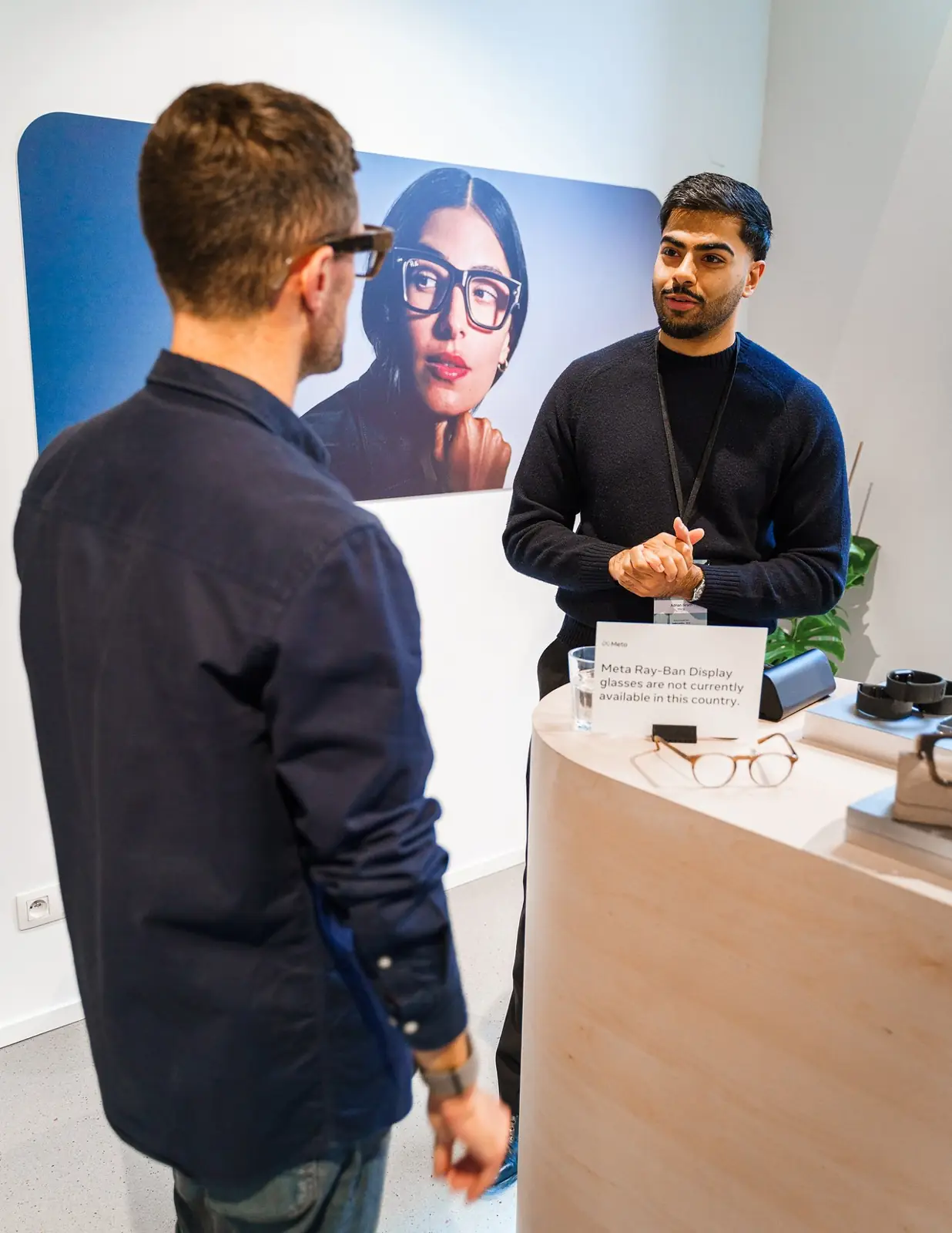 A guest at the AI glasses demo counter