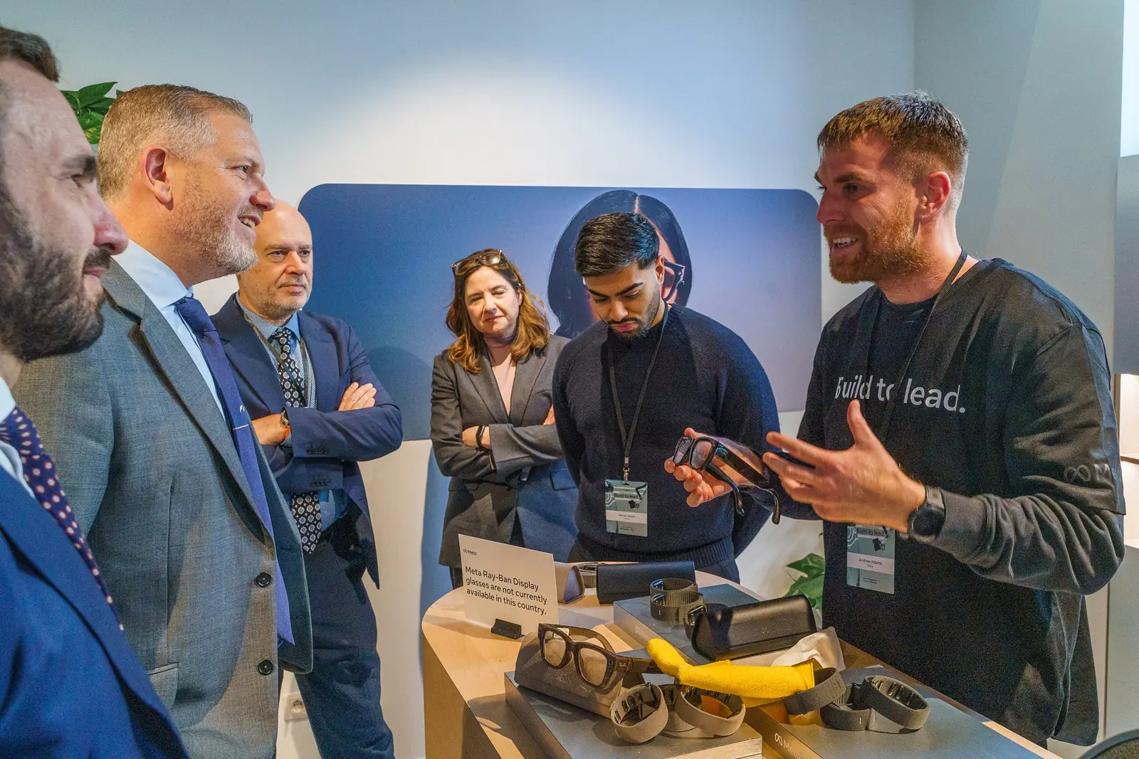 Guests gathered round a demo of AI glasses