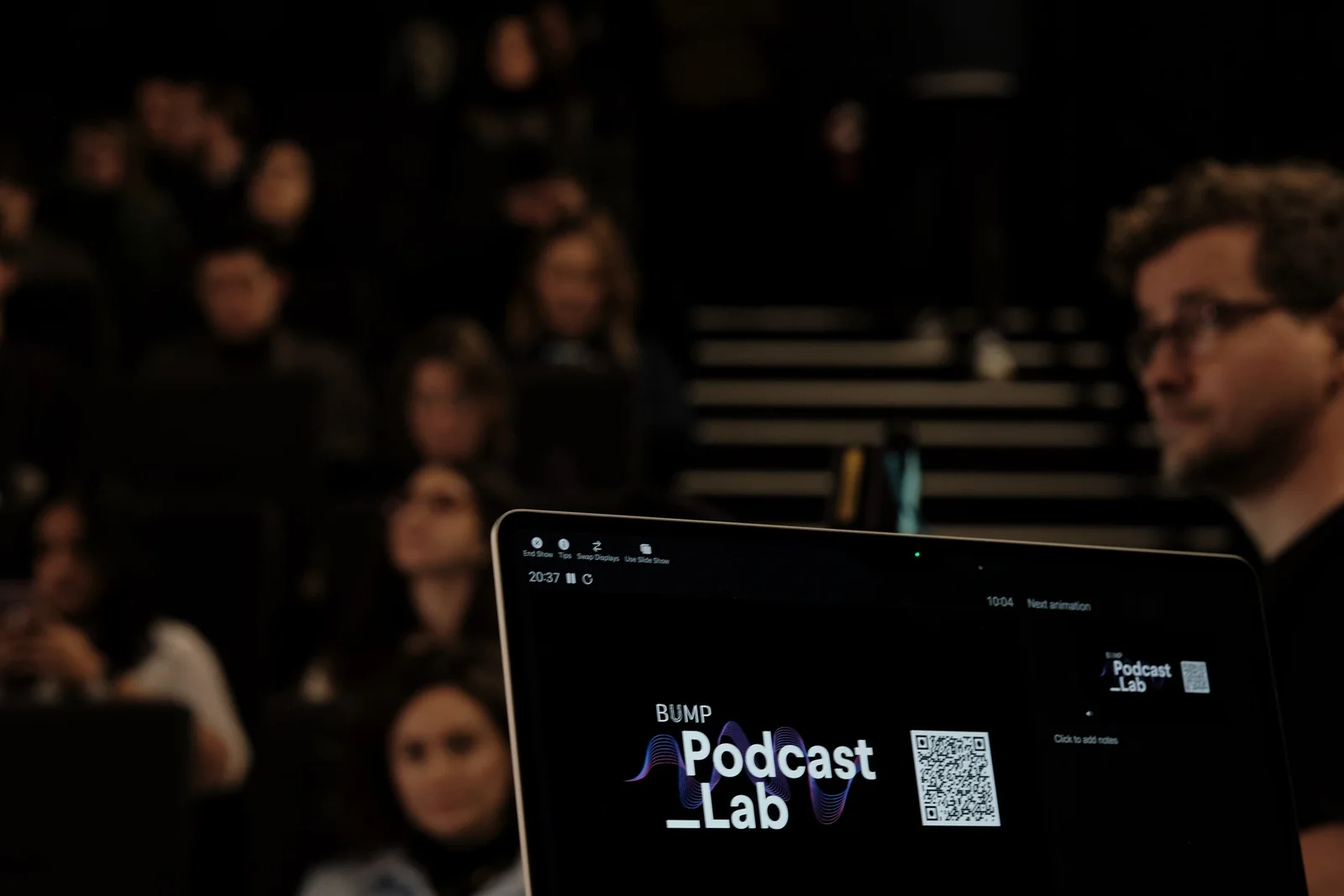 A laptop showing the Podcast Lab holding slide