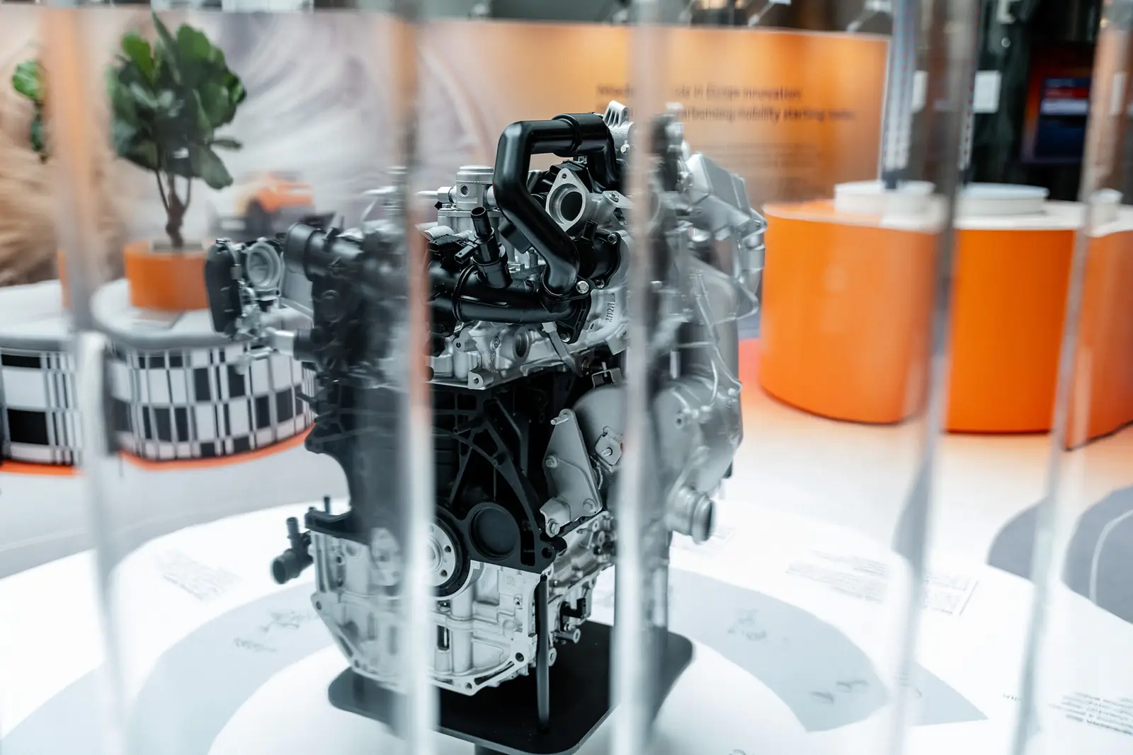 Close-up of the hybrid powertrain engine, seen through the acrylic tubes
