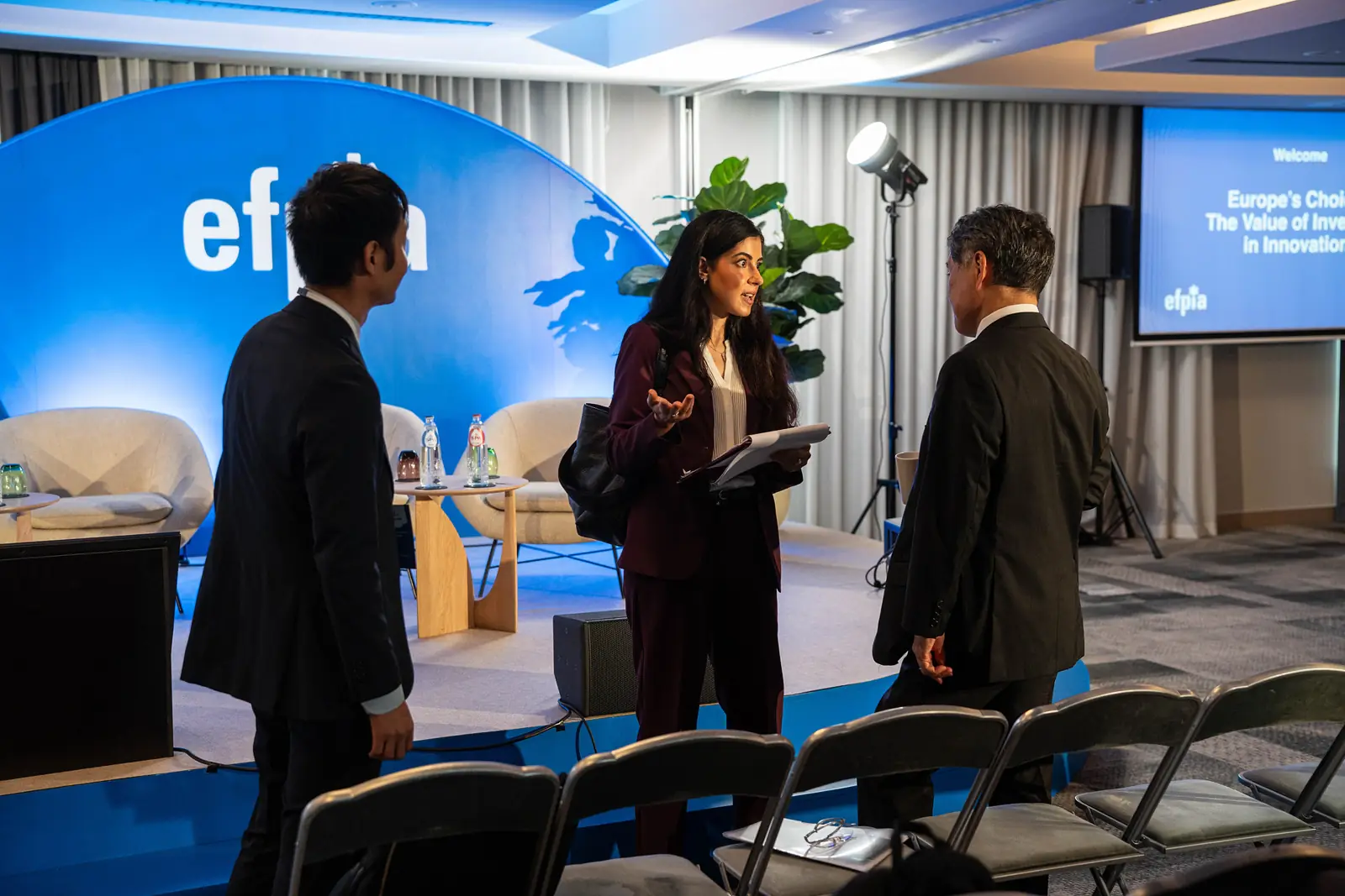 Speakers preparing on stage before a session