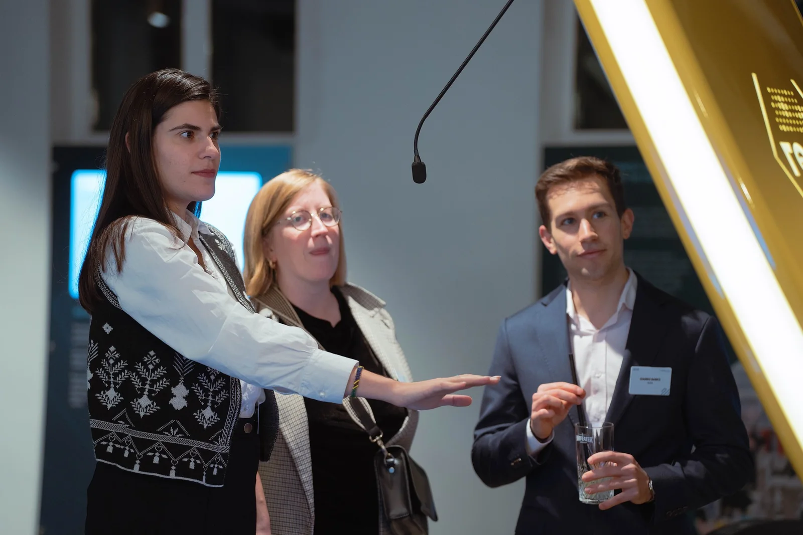 Visitors talking beside the installation