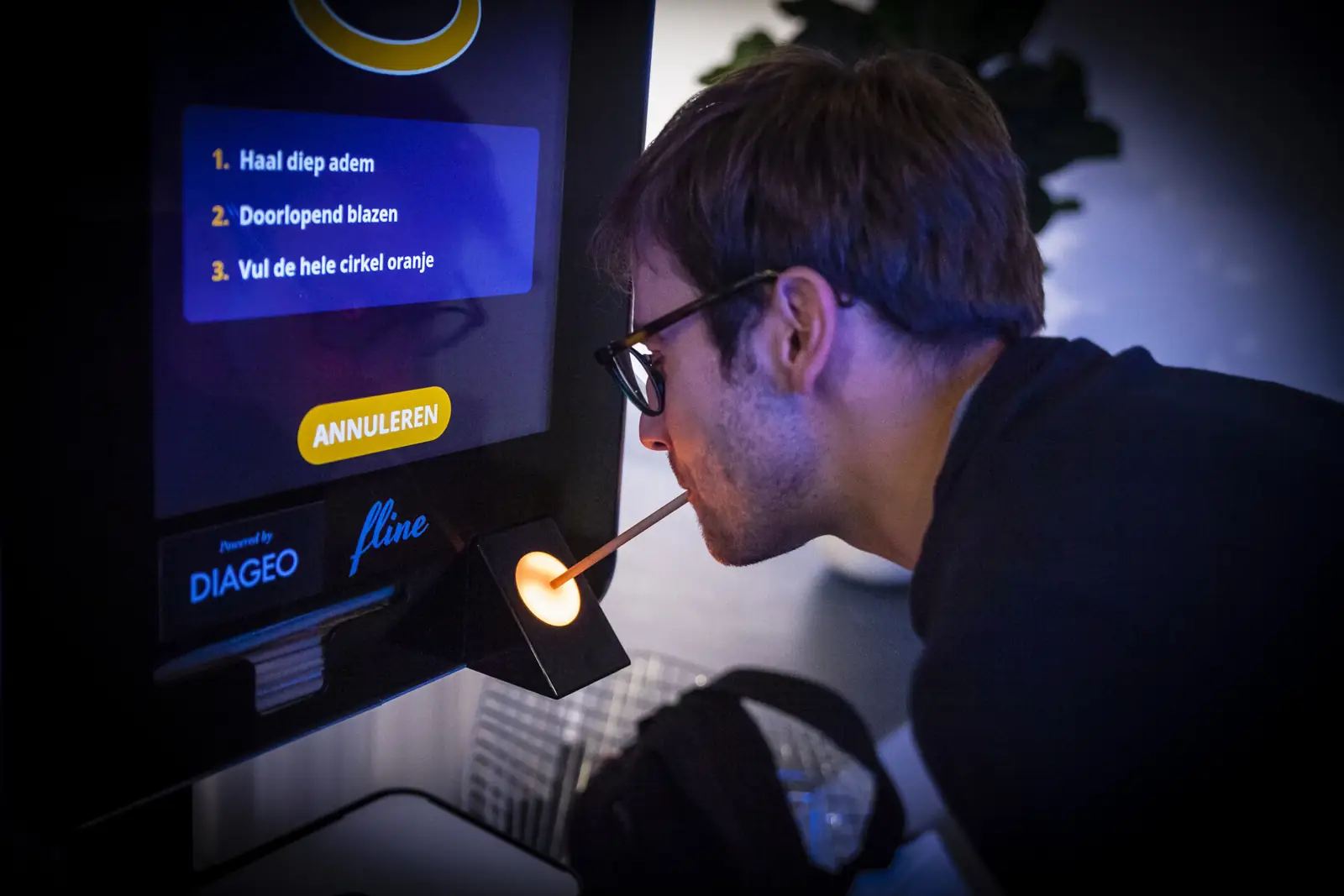 A guest trying a breath-testing station powered by Diageo