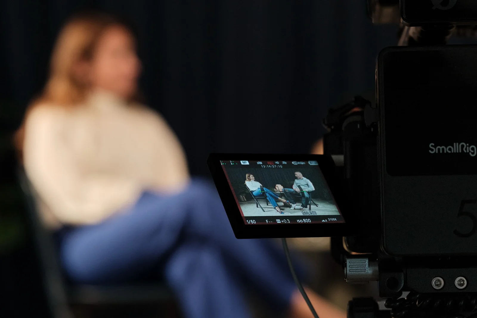 A camera monitor framing the conversation