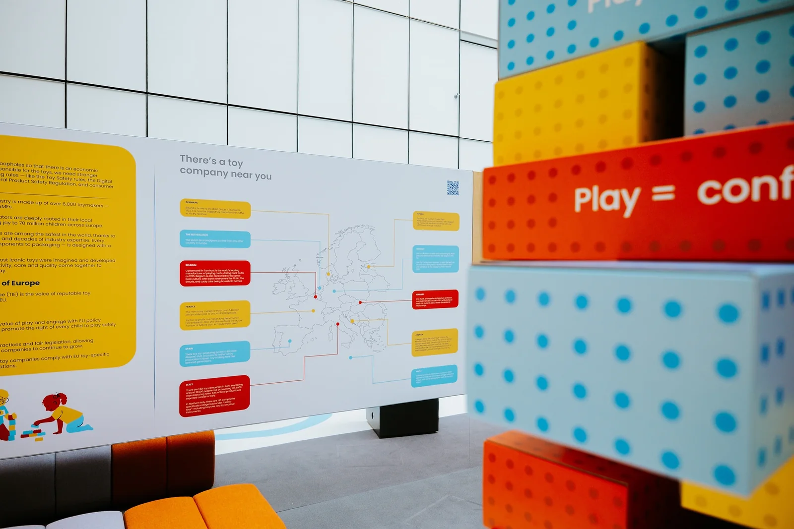 An information wall beside the block tower